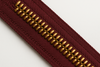 dark cranberry wine zipper tape with corn bronze teeth