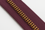 medium mulberry zipper tape with corn bronze teeth