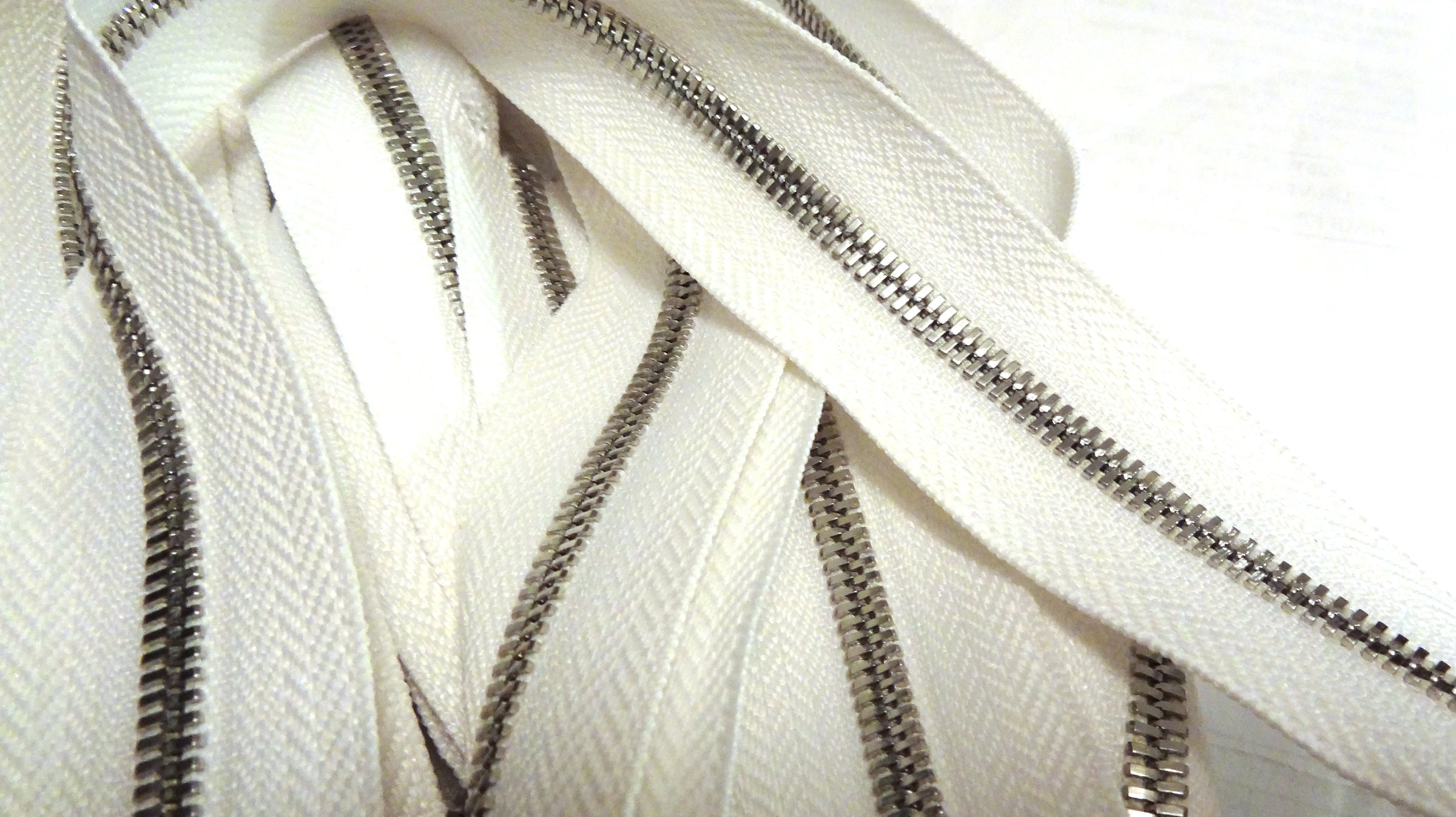 Premium Photo  Zipped and unzipped metallic zipper lock on white